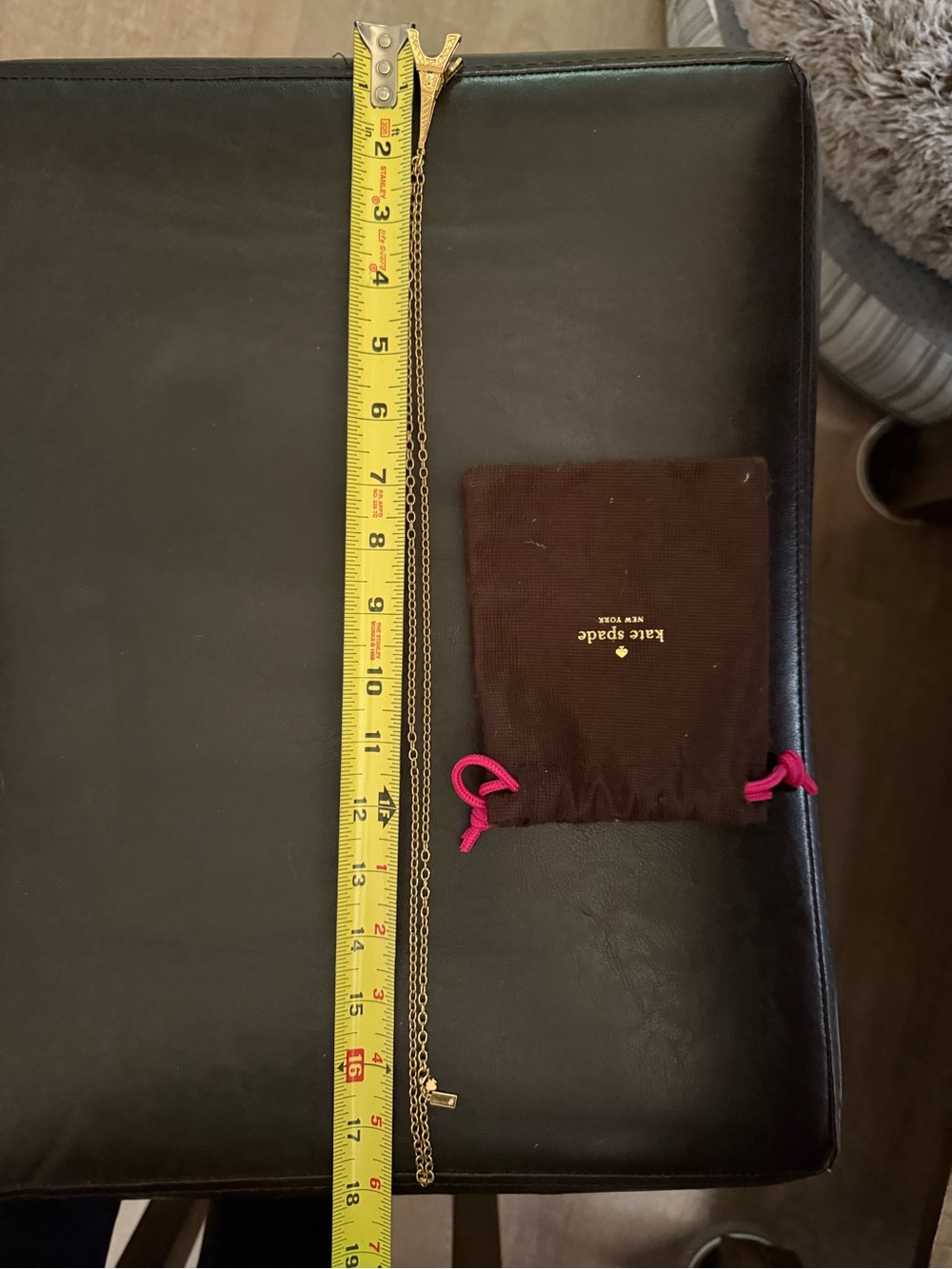 kate spade gold-tone chain necklace with brown pouch and pink ties